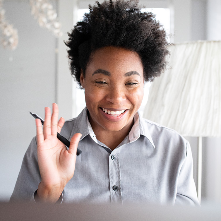 Lady smiling on a video conference